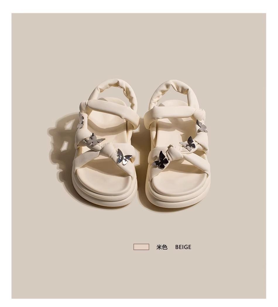 

thick-soled white sandals female 2025 summer new stepping on shit feeling word belt Roman shoes fairy wind pregnant women beach shoes 35