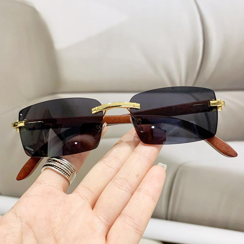 New frameless trimmed personalized sunscreen sunglasses catwalk travel fashion versatile wood grain legs advanced sunglasses