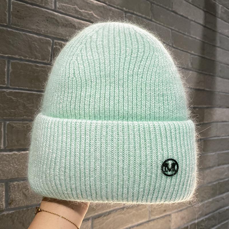 Herbst und Winter Neue Metallbuchstabe M Standard Strickwollmütze Warmer Ohrenschützer Kopf Kälteschutzmütze