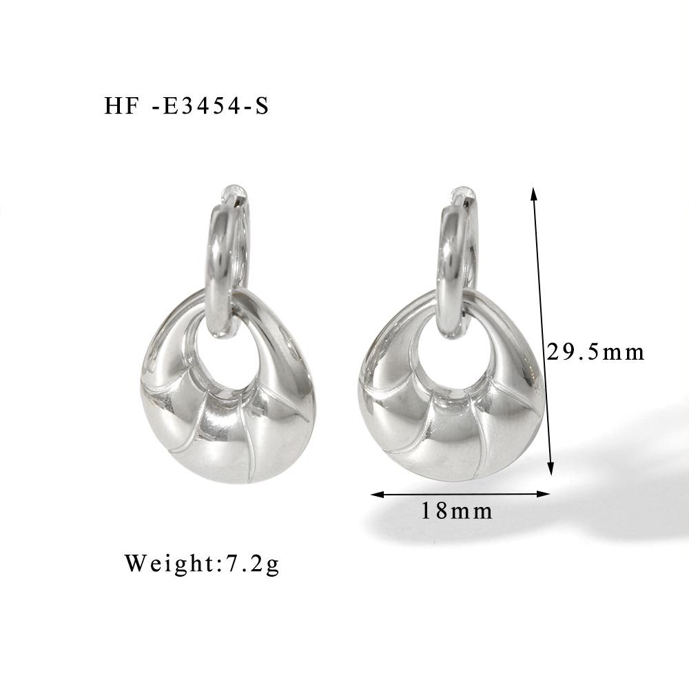 

Серьги-кроссаны из титановой стали - Ручная полировка, Высококлассные, Модные, Универсальные украшения.