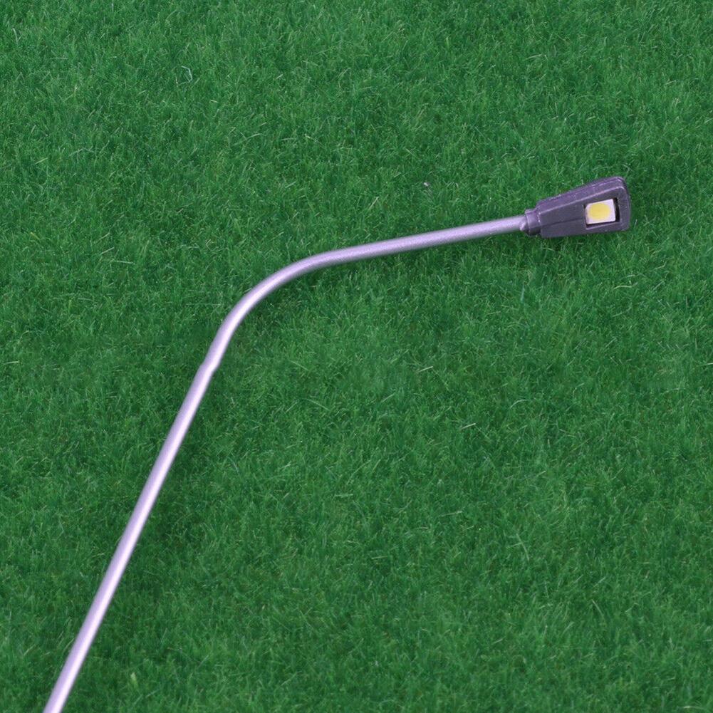 10 Stück. Modelleisenbahnen im O-Maßstab, Metalllichtmasten, verkabelte LED-beleuchtete Straßenlaternen