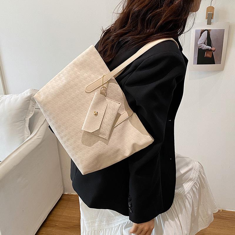 This year's new fashionable textured woven pattern handbag commuting shoulder bag going out travel three-piece tote bag