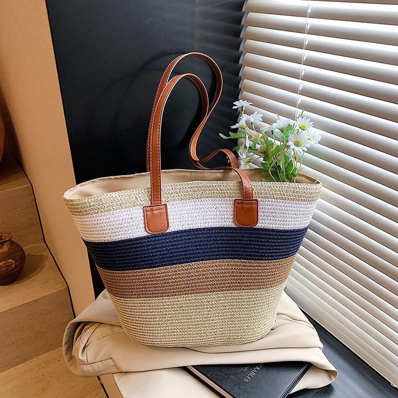 

Niche striped woven big bag women s new commuter versatile straw woven tote bag seaside beach bag