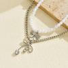 Alloy hollow bow pendant stacked with simple temperament pearl necklace light luxury niche design