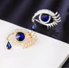 Luxury Crystal Eye Brooch Pin with Rhinestone Embellishments High-End Sweater Coat Accessory Elegant Tear Drop Design Fashion Jewelry