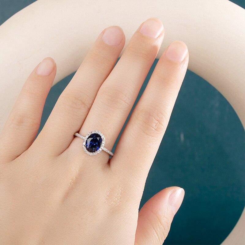 BELLA BOX Klassischer Damenring mit ovaler Form, blauen Edelsteinen, Zirkon, silberfarben, Finger, Hochzeit, Verlobung, Brautschmuck