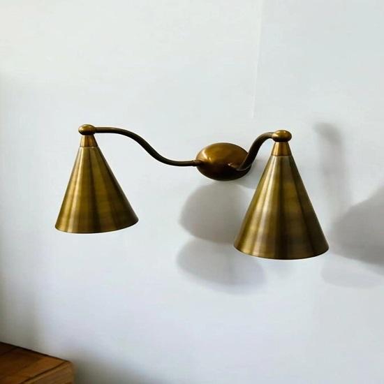 

Elegant mid-century brass double wall sconce with tapered rough-hewn shades