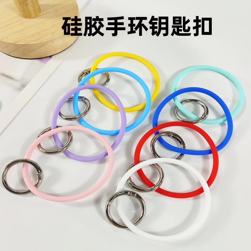 Einfarbige Silikon-Handyhülle mit befestigtem Schlüsselanhänger-Lanyard zum Schutz vor Verlust.