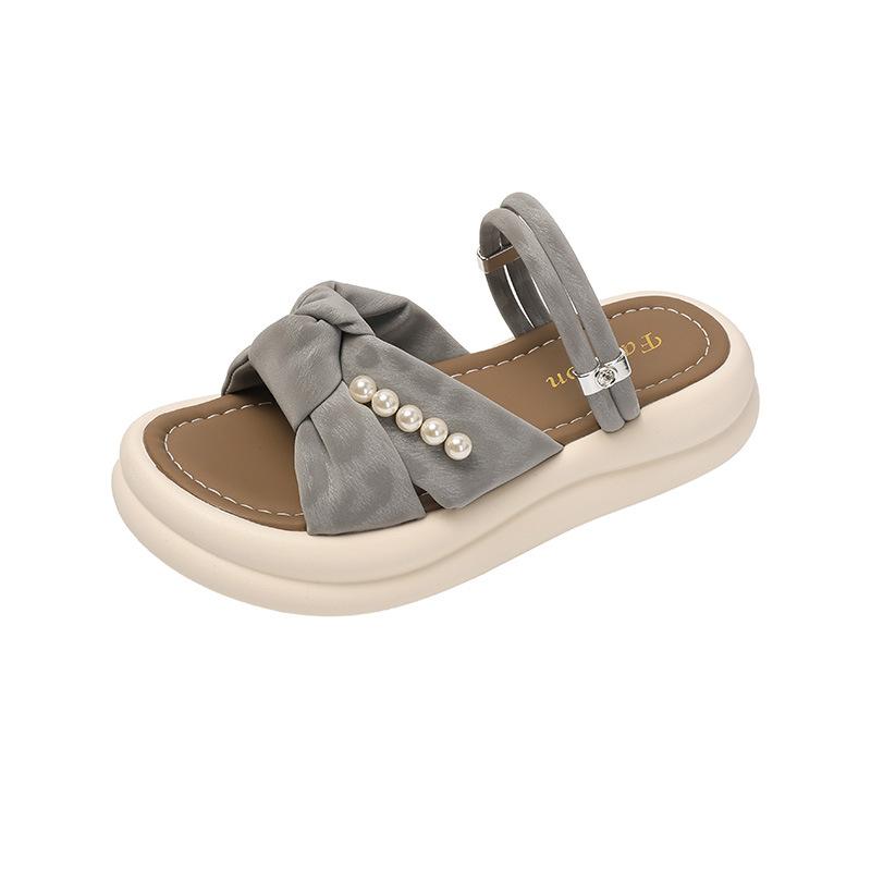 Thick-bottomed cool slippers female 2025 summer new fairy wind outside wear Internet celebrity versatile pearl bow word slippers
