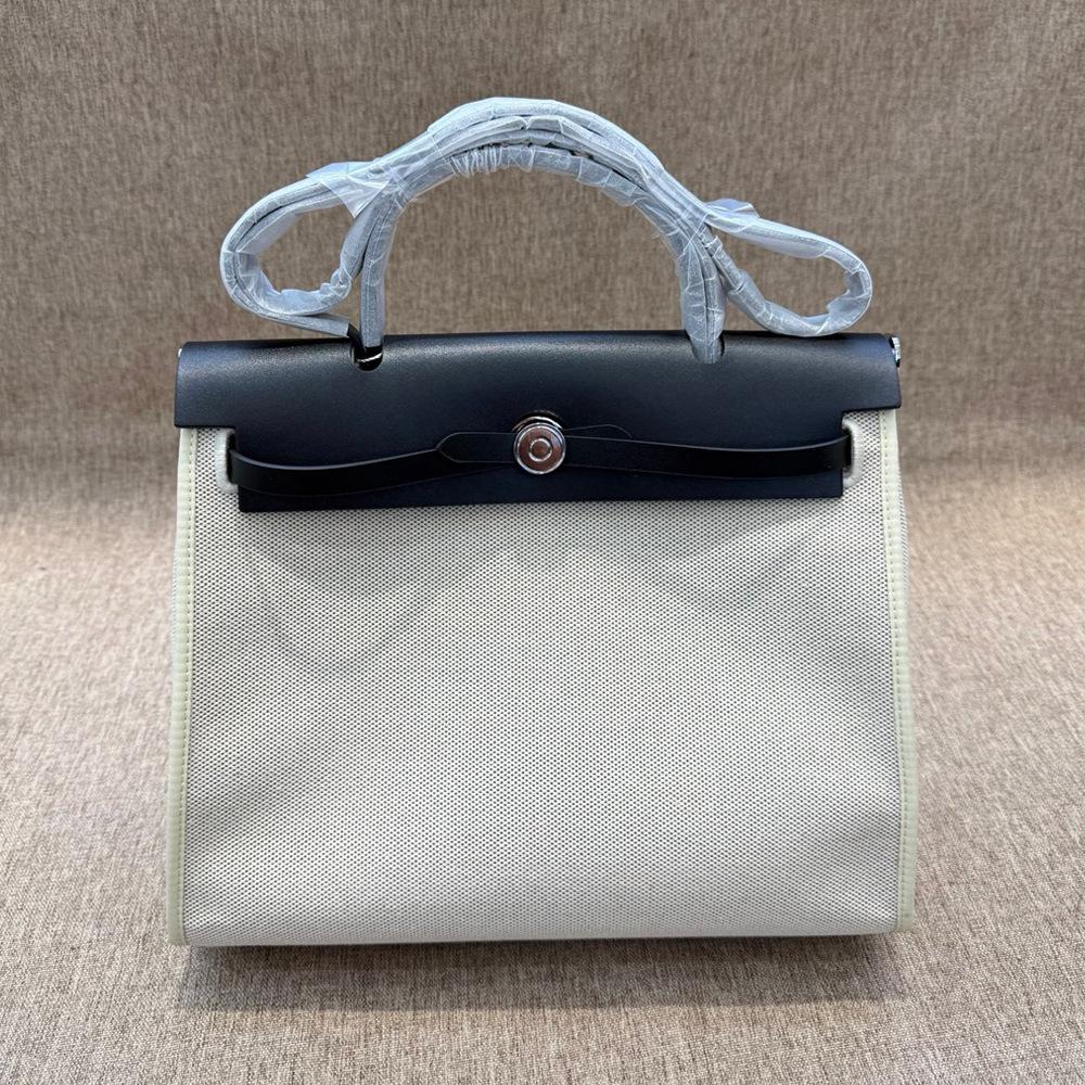 

Женская сумка из холста 2025 года, новая сумка через плечо из коровьей кожи с контрастным цветом холста Length 31cm x Thickness 11cm x Height 25cm