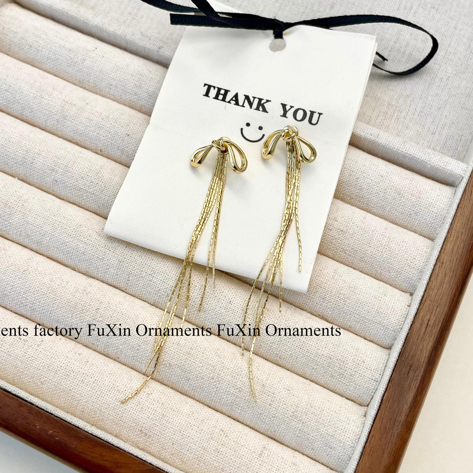 

Gold and Silver Bow Tassel Earrings - Elegant Long Design E0674