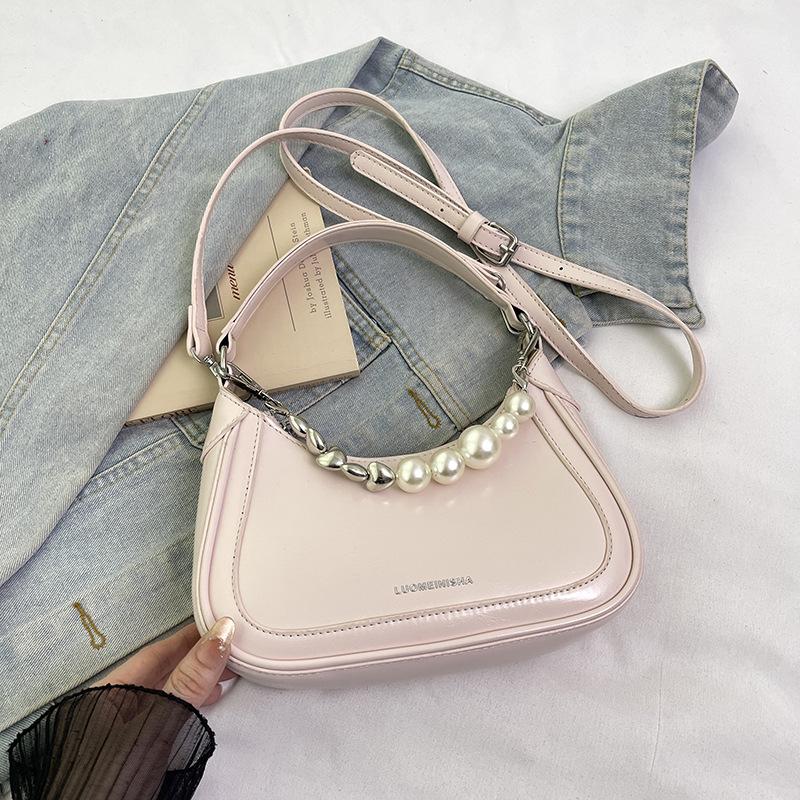 

Модная белая сумка подмышку женская 2025 новая атмосфера высокого класса нишевая высокая ценность косой кроссбоди портативная маленькая сумка розовый