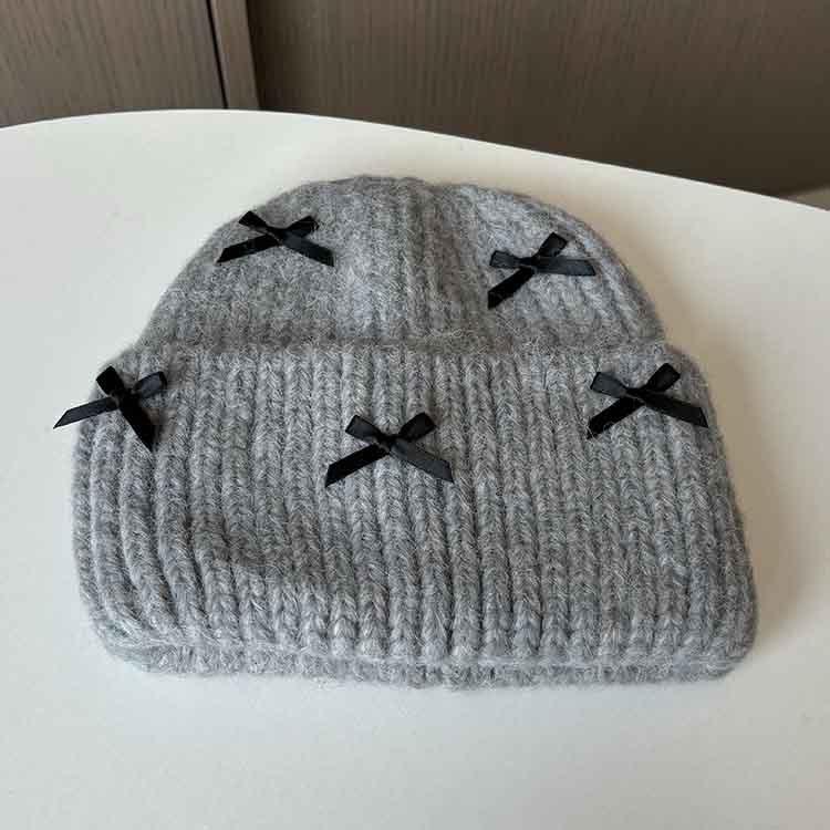 Wool hat women's autumn and winter new bow knitted hat shows a small face, warm ears, bag head, all-match cold hat