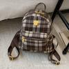 Autumn and winter popular woolen plaid backpack 2025 versatile temperament high sense women commuting niche design small bag