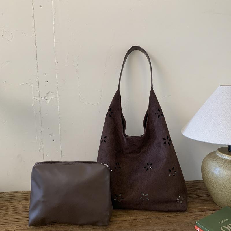 

Autumn and winter suede fashion hollow engraved design lazy style personality versatile fashion shoulder armpit bag