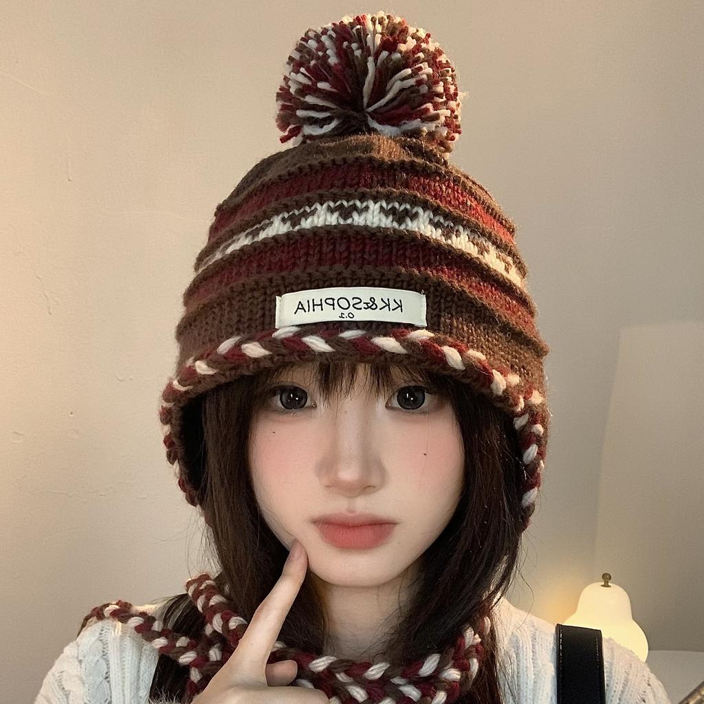 Cozy Chic Knitted Winter Hat For Women Featuring Colorful Pom Poms And Warmth
