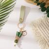 European & American Sweet Butterfly Daisy Silicone Beaded Keychain with Leather Bow Pendant