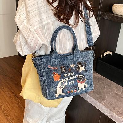 2025 Nova Bolsa Balde de Jeans Estampada com Gato de Desenho Animado da Moda Versátil Casual para Trabalho Grande Capacidade Transversal de Ombro para Mulheres