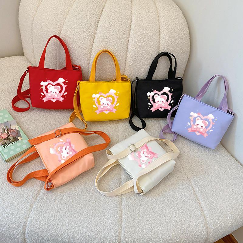 Fashionable Nylon Kids Handbag Featuring Cute Bear Print And Breathable Design