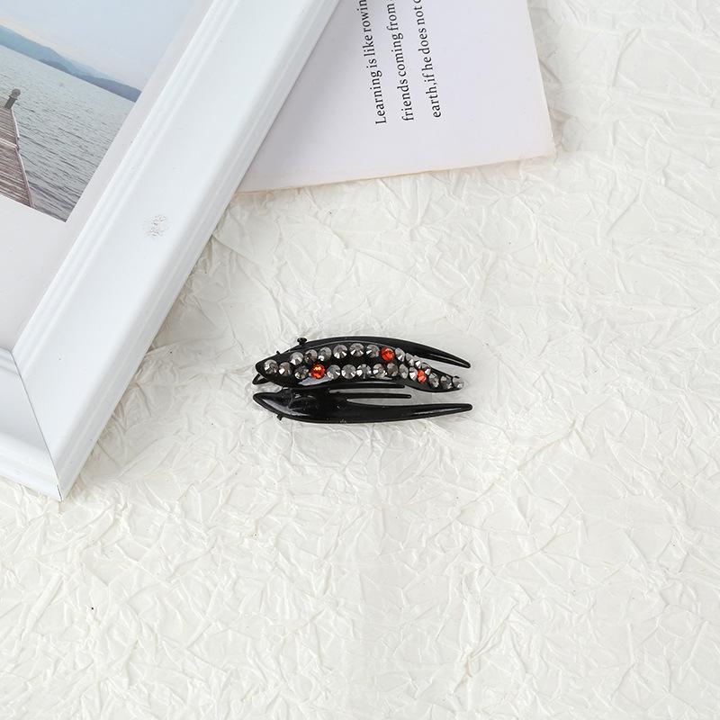 

Маленький зажим-краб со стразами для пучков и хвостиков