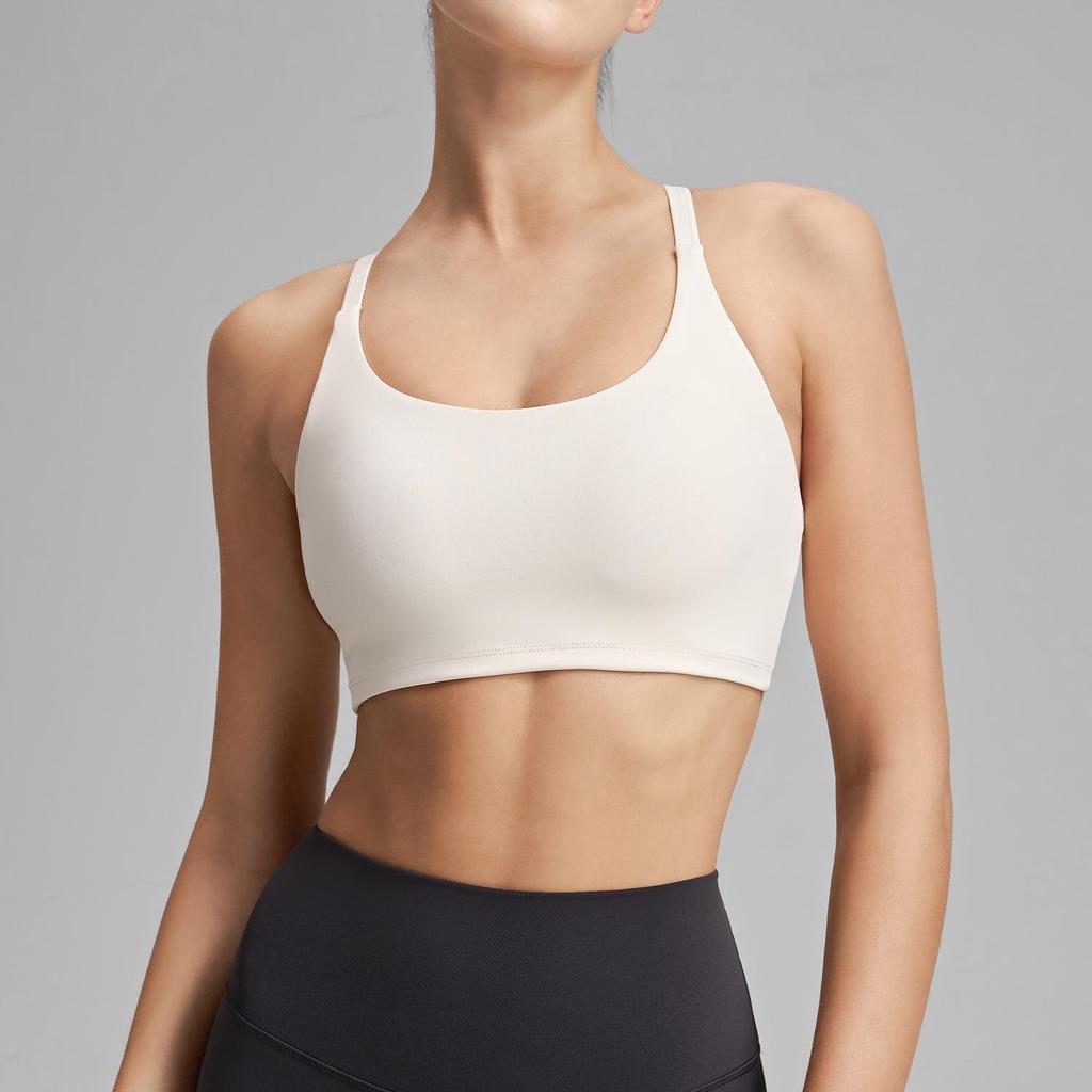 Women's Cross-Back Sports Bra: Sexy, Stylish Design for Pilates, Fitness, and Yoga, with Fixed Cups and Thin Straps for Outdoor Wear.