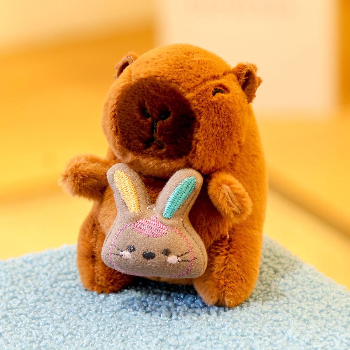 

Capibara doll toy capybara doll holding rabbit bear plush doll bag pendant capybara keychain Approx. 12cm/52g