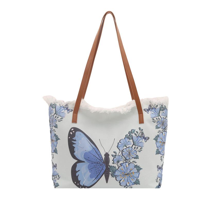 

Niche printed bucket bag women s new trendy cartoon graffiti shoulder messenger bag fashionable girl tote bag синій