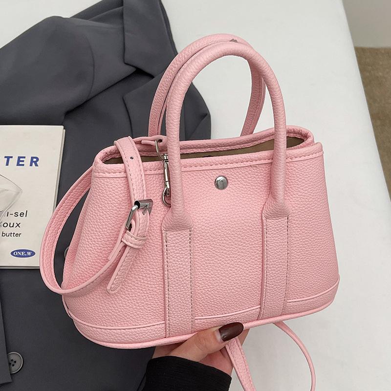 New Niche Simple Leisure Commuter Portable Bucket Bag Versatile Design Sense Solid Color Messenger Bag Women