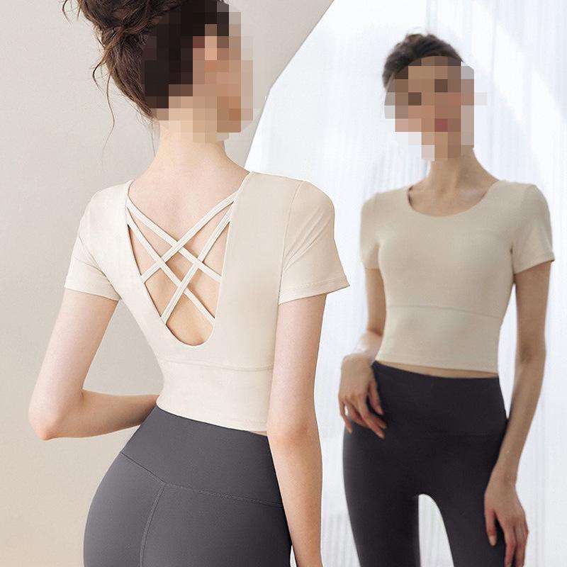 Damen Herbst/Winter Yoga Top mit integriertem BH, Langarm, Ausgeschnittenem Rücken, Trägern und Polstern.