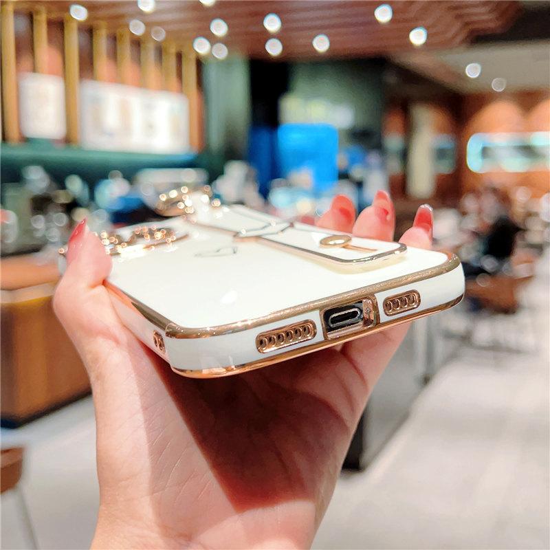 Funda para teléfono con correa de muñeca chapada para iPhone 14 13 12 11 Pro Max Xs Max Xr 13pro 14 Plus 11 a prueba de golpes suave parachoques amor corazón cubierta