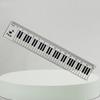 A Ruler for Music Enthusiasts, a Piano Keyboard, And a Tool for Measuring Musical Staff
