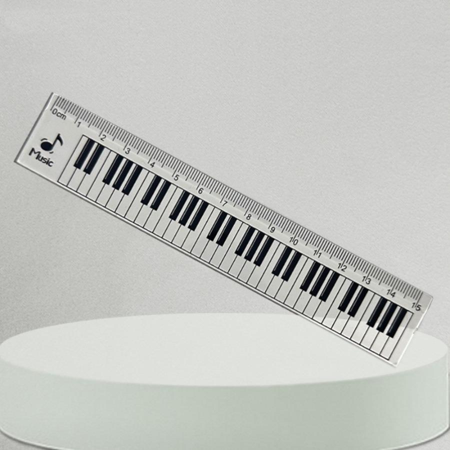 A Ruler for Music Enthusiasts, a Piano Keyboard, And a Tool for Measuring Musical Staff