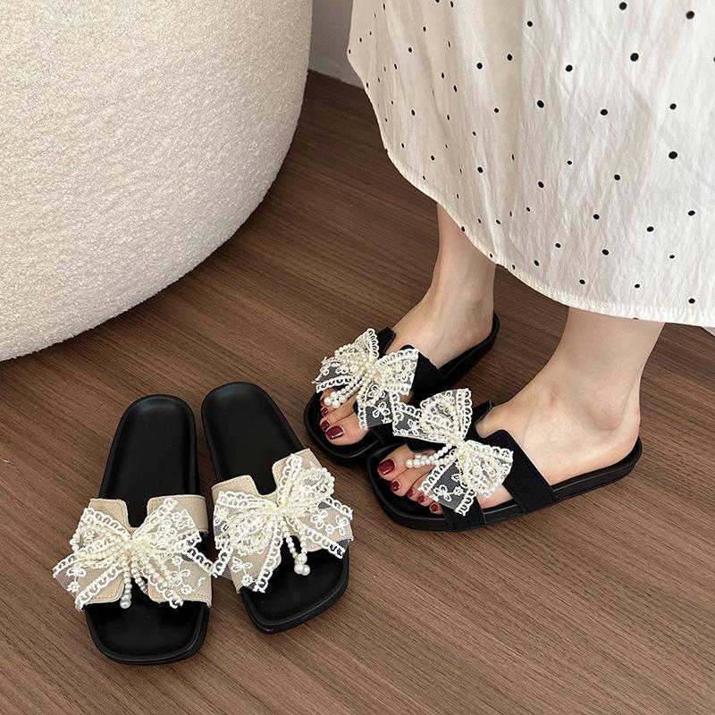Sweet lace bow one-word female summer flat bottom cool slippers light and comfortable outer wear casual Korean version cool slippers