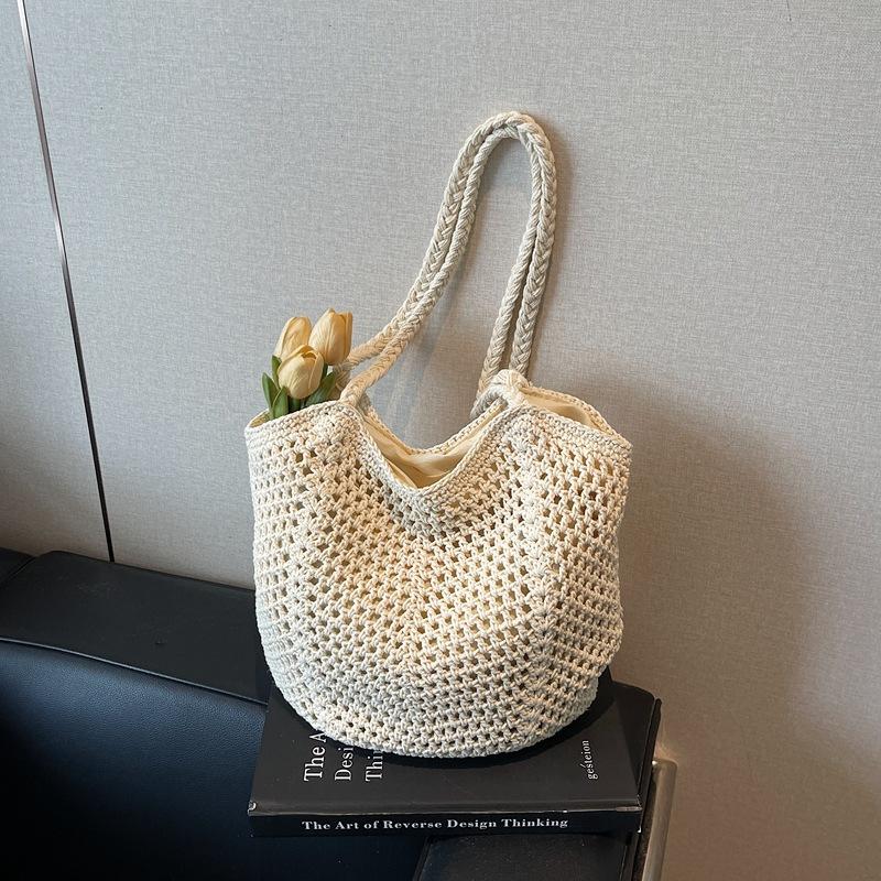 Woven bag women's large-capacity new spring and summer versatile leisure hollow shoulder vacation beach tote bag