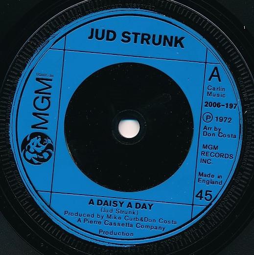 

7-дюймовая пластинка JUD STRUNK A Daisy A Day 2006197 MGM Records 1972 Великобритания Кантри/Фолк Б/у