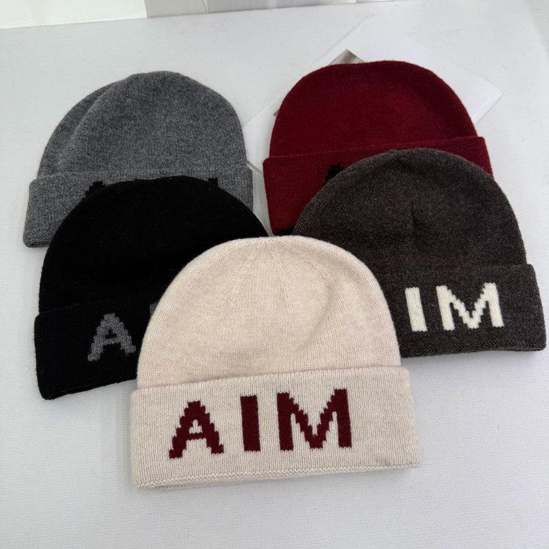 Niche personalized letter knitted hat children's autumn and winter new wool hat warm ear protector bag head cold hat