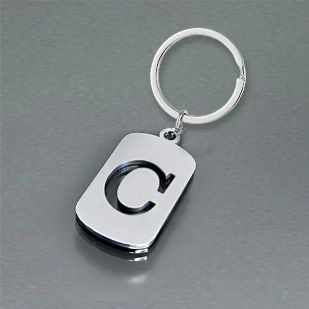 Englischer Buchstaben-Tag-Schlüsselanhänger, glatter Edelstahl, hohl, ABC, personalisierte Schlüsselanhänger, Handtaschen-Ornament