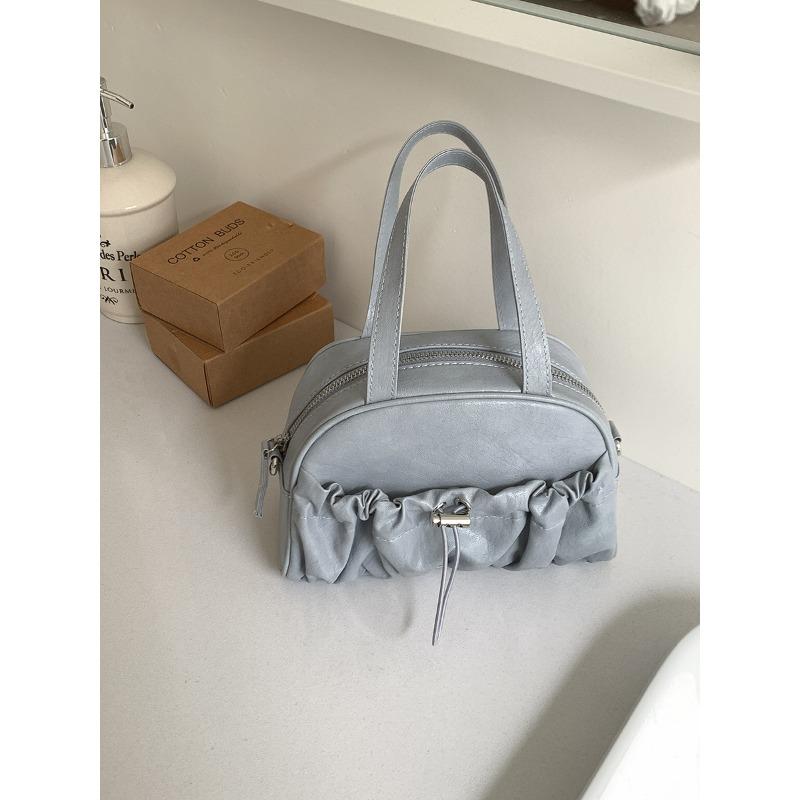 

Hand-held bowling bag fashionable personality folds new women s handbag niche design messenger saddle bag синий