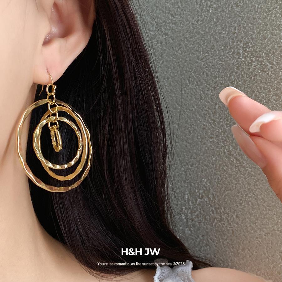 Bohemian round thread hollow multi-layer ear hook European and American cold wind earrings light luxury high-end earrings