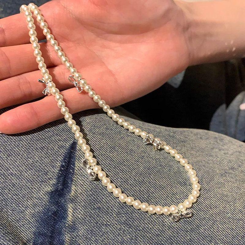 

Pearl bow tassel necklace fashion versatile high sense collarbone chain light luxury niche temperament jewelry women