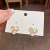 Silver needle zir*****pal flower stud earrings, small temperament design earrings, fashionable and versatile earrings.