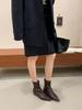 2025 autumn and winter new pointed-toed woven loose sleeve wedge short boots women's inner height-increasing and medium boots