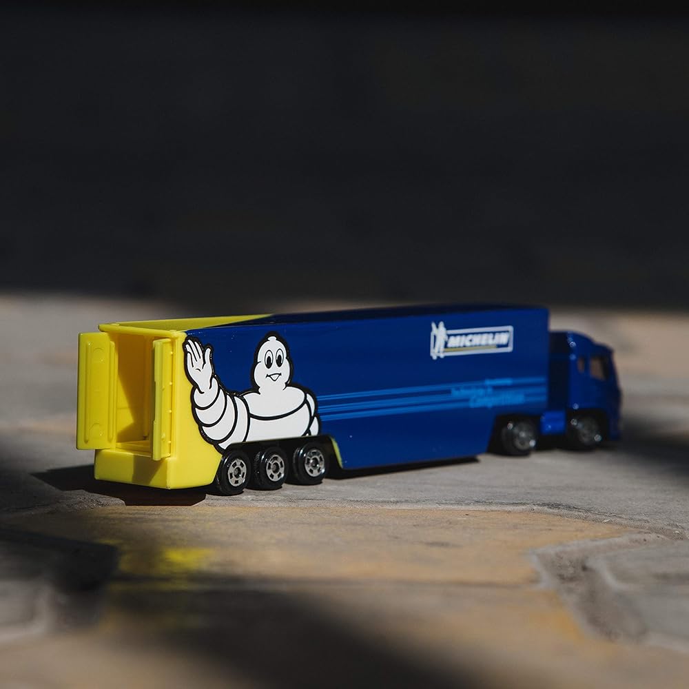 Takara Tomy Tomica No.135 Michelin Motorsports Transporter Toy Car for Ages 3 and Up