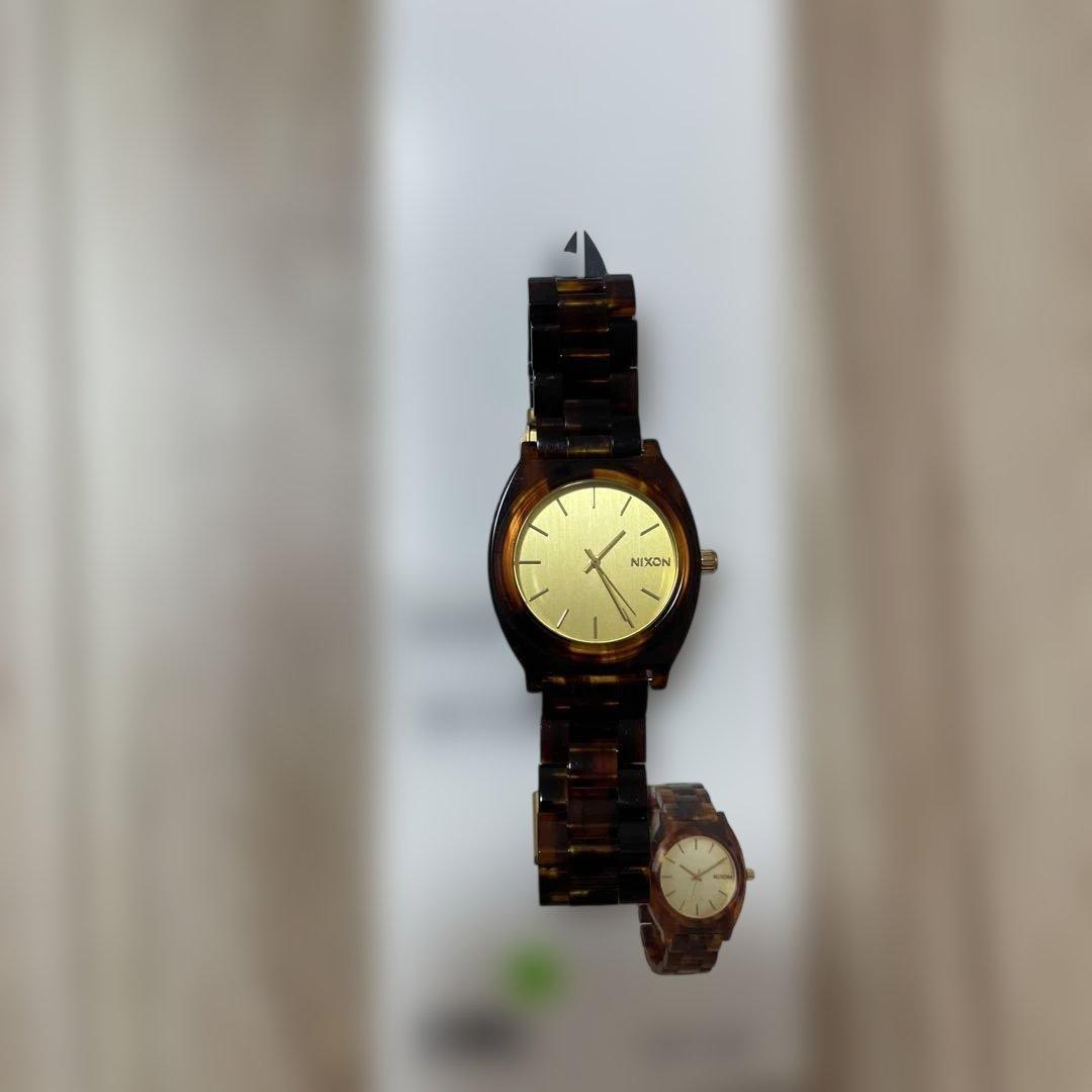 Used NIXON watch tortoiseshell pattern gold dial out of battery