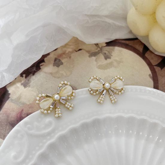 

Элегантные простые серьги с бантом