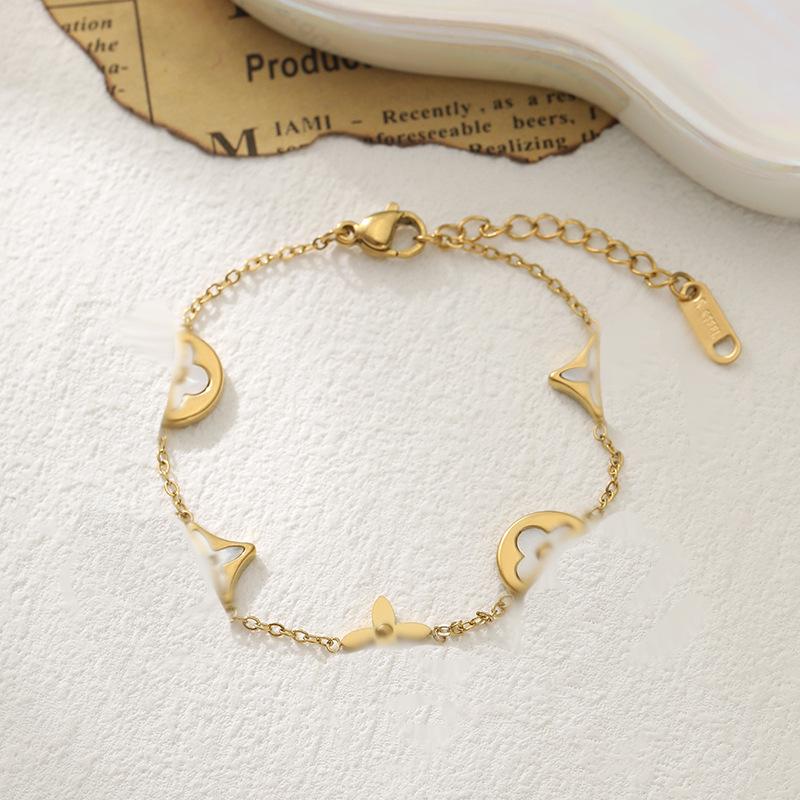 Raffinato Bracciale Quadrifoglio Guscio Bianco Acciaio di Titanio - Gioiello Elegante e Lussuoso da Donna