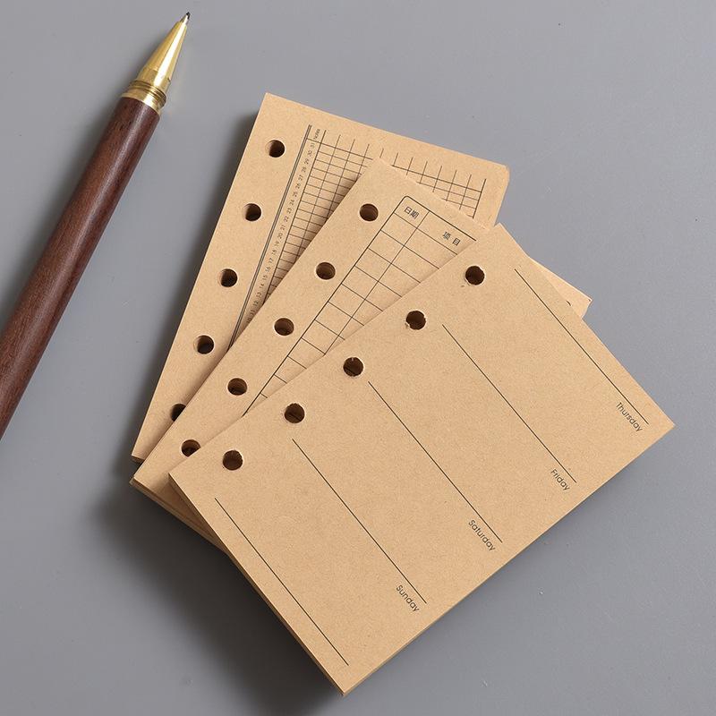 Die Innenseite des M5 Notizbuchs Die leere vertikale Linie des A8 Loseblatt-Kernquadrats und der Wochenplan Eine Seite pro Tag zum Eintragen