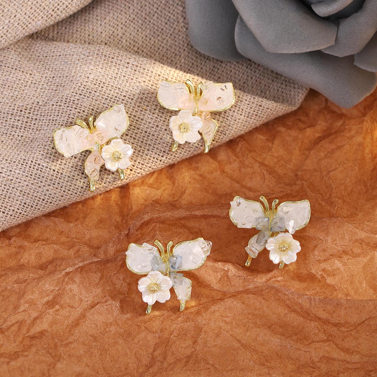 

Gradient Blue Crushed Stone Earrings with Pink Butterfly Design for Women