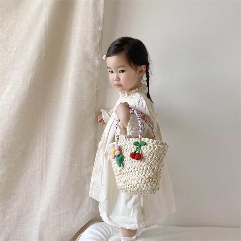 Stylish Unisex Kids Woven Bucket Bag In White Lace With Playful Cherry Print