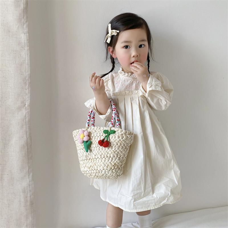 Stylish Unisex Kids Woven Bucket Bag In White Lace With Playful Cherry Print